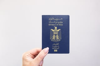 Woman Holding An Iraqi Passport